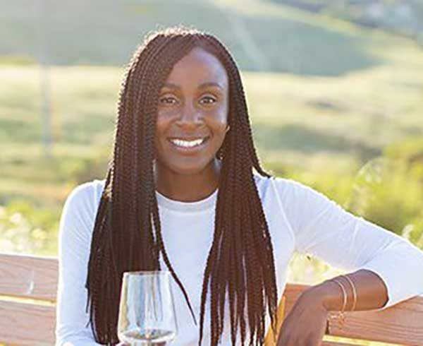 CASSANDRA FELIX holding wine glass