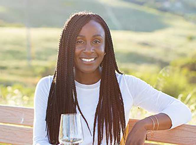 CASSANDRA FELIX holding wine glass