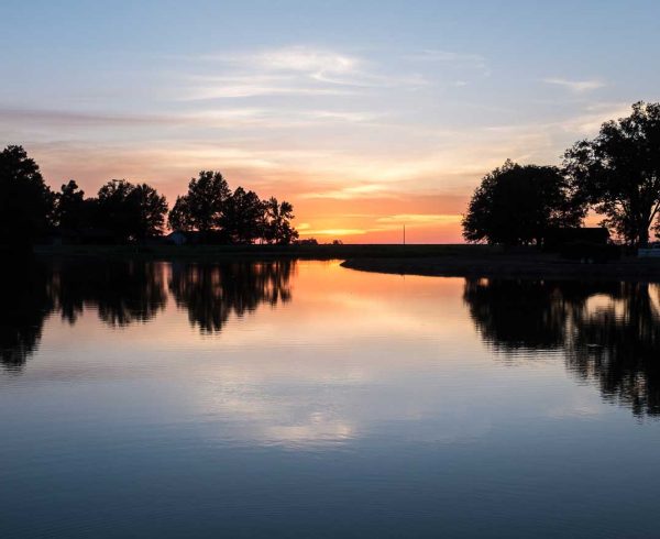 Sunset over water in Wilson, AR