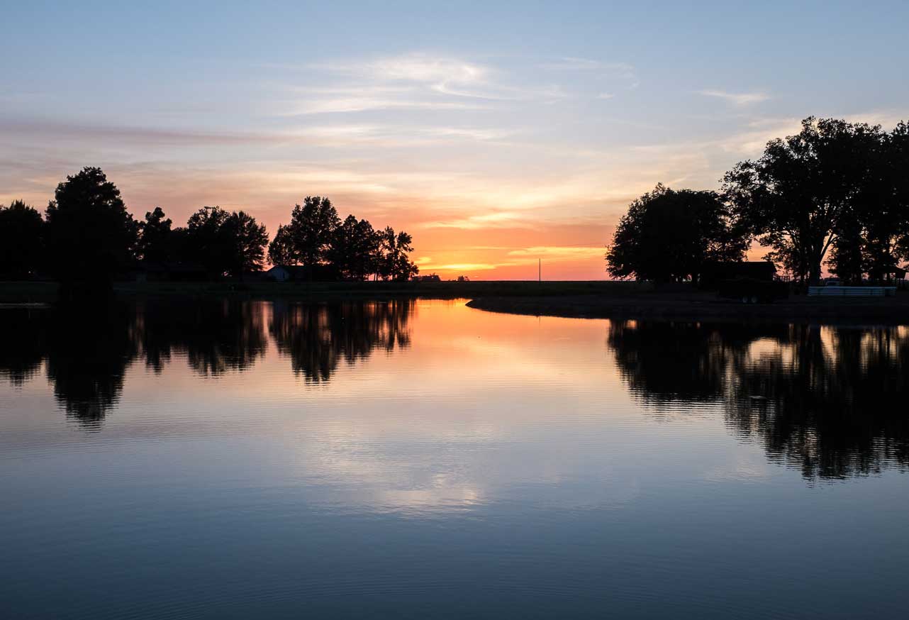 Sunset over water in Wilson, AR