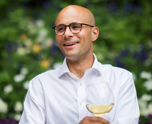 Photo of Carlton McCoy, CEO of Heitz Cellar in Napa Valley holding wine glass (Daniel Krieger Photography).