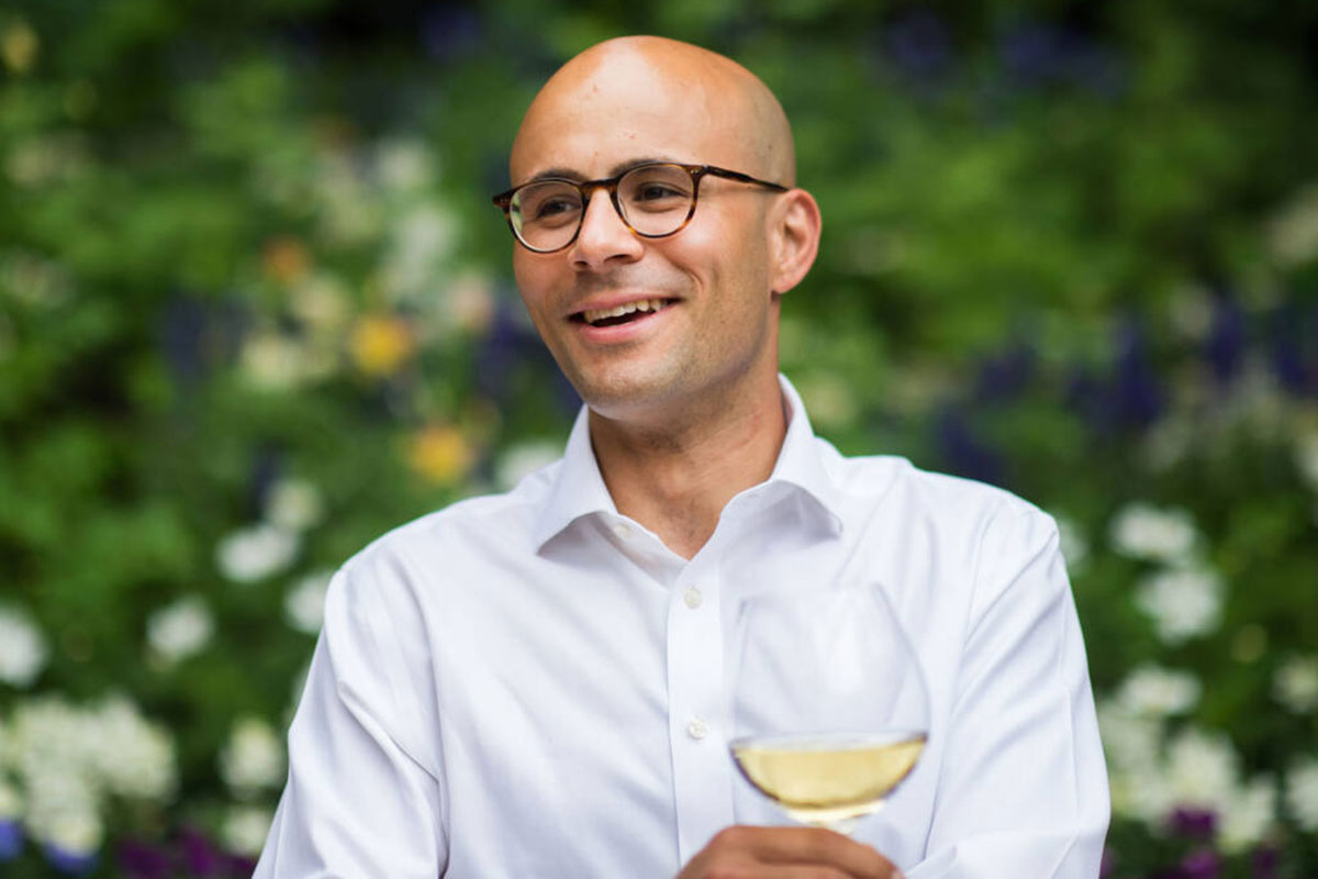 Photo of Carlton McCoy, CEO of Heitz Cellar in Napa Valley holding wine glass (Daniel Krieger Photography).