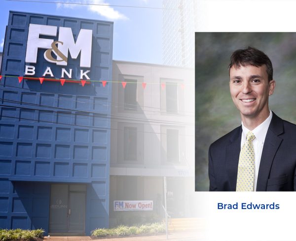 BRAD EDWARDS headshot over F&M Bank building photo.