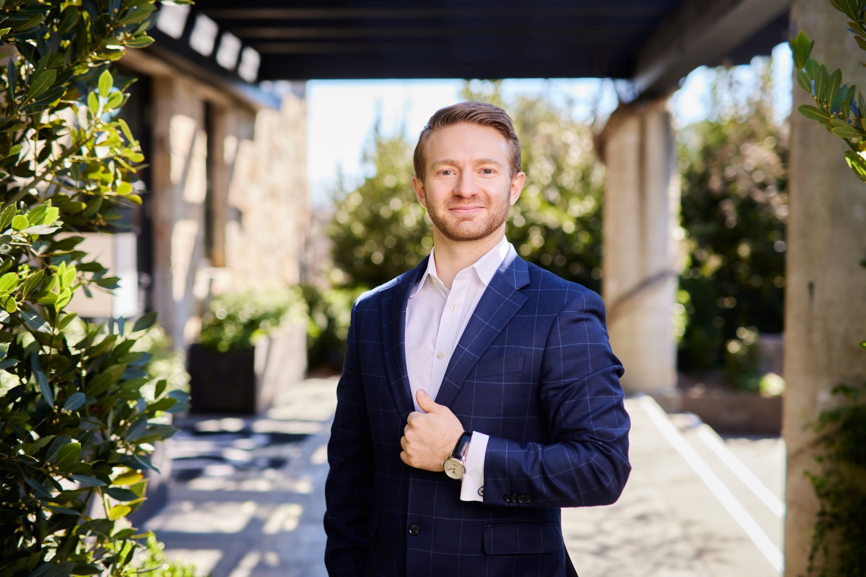 Heitz Cellar master sommelier, Erik Elliott posing outside of vineyard main building.