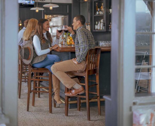 A couple drink wine at a a Wilson, Arkansas cafe.