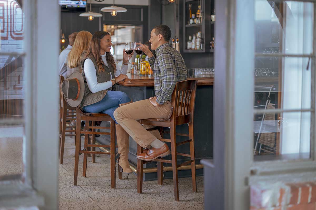 A couple drink wine at a a Wilson, Arkansas cafe.